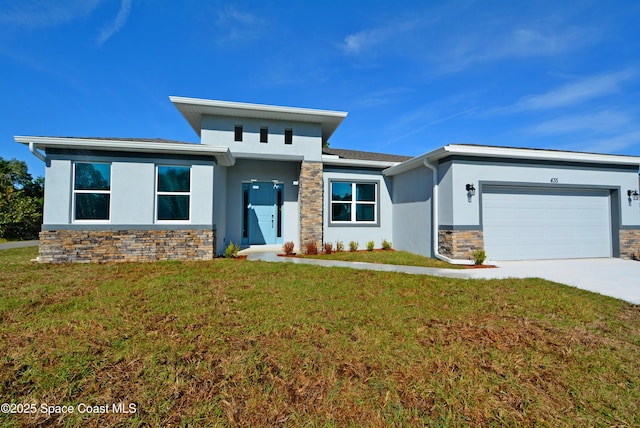 view of front of house with a garage and a front yard