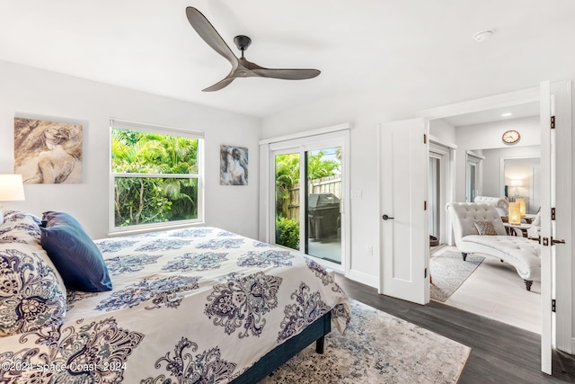 bedroom with access to exterior, ceiling fan, and dark hardwood / wood-style flooring