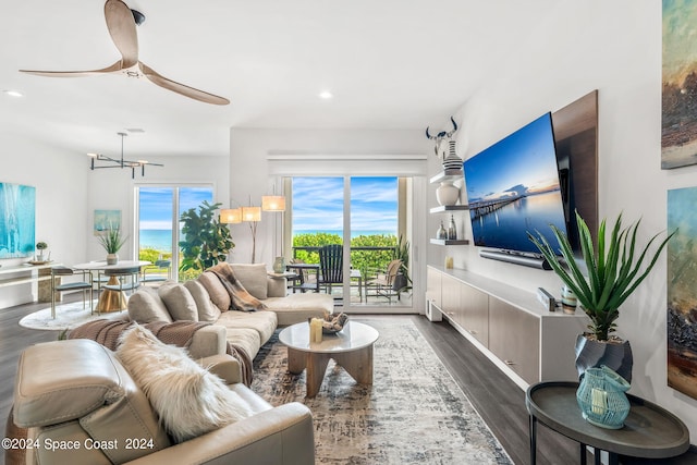 living room featuring hardwood / wood-style floors and ceiling fan