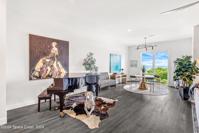 interior space featuring a chandelier and dark hardwood / wood-style flooring