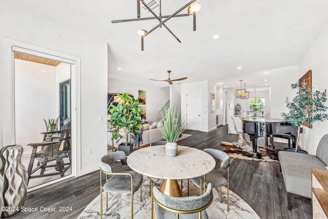 dining space featuring dark wood-type flooring and ceiling fan