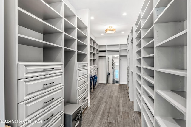 walk in closet with light wood-type flooring