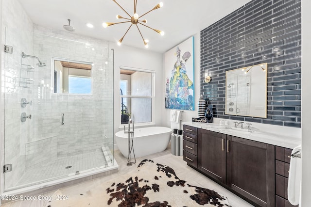 bathroom featuring tile patterned floors, tile walls, shower with separate bathtub, and vanity