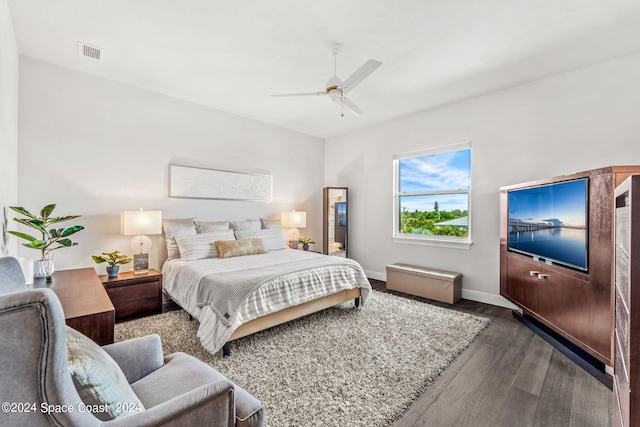 bedroom with ceiling fan and wood-type flooring