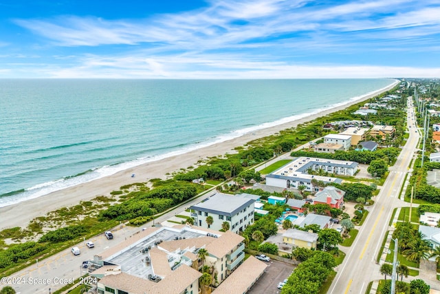 bird's eye view with a view of the beach and a water view