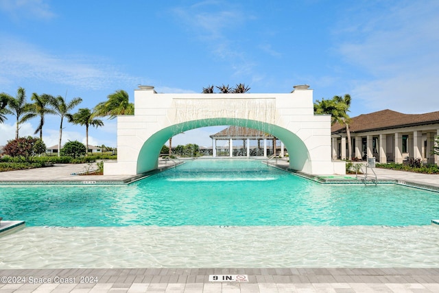 view of pool featuring a patio and a water slide