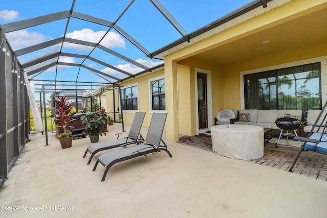 view of patio / terrace with a lanai