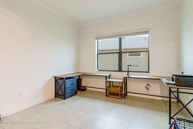 office featuring light tile patterned floors and crown molding