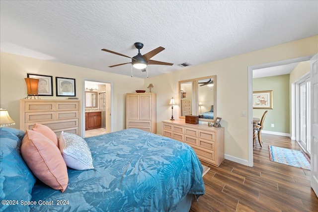 bedroom featuring connected bathroom, ceiling fan, dark hardwood / wood-style flooring, and a textured ceiling