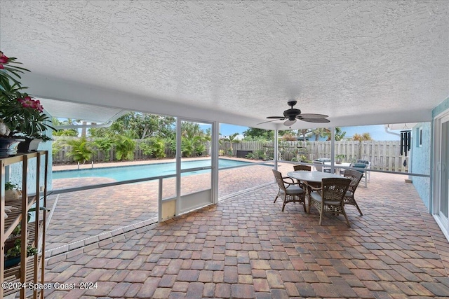 view of pool featuring ceiling fan and a patio