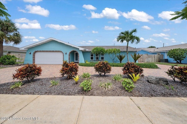 ranch-style home featuring a garage