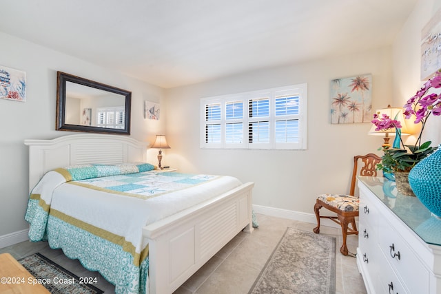 bedroom featuring light tile patterned floors