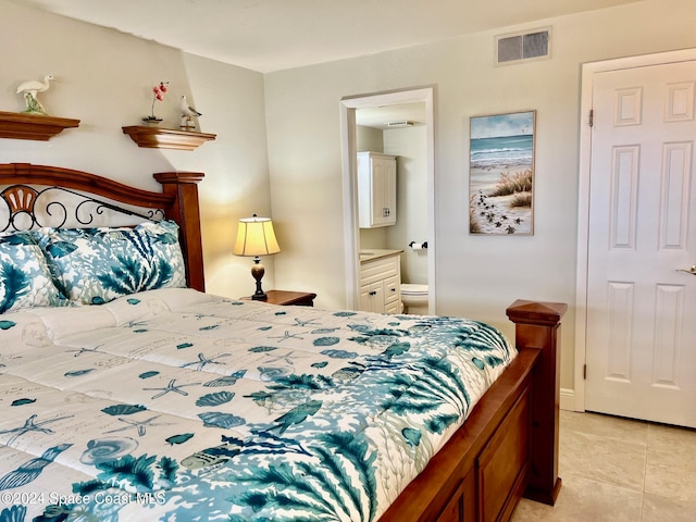 tiled bedroom with connected bathroom