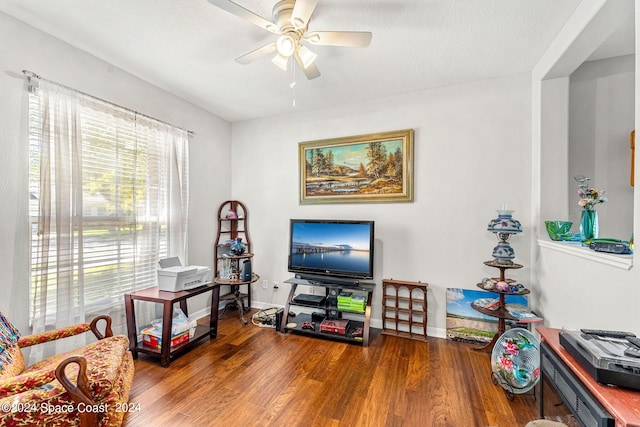 interior space with ceiling fan and dark hardwood / wood-style floors