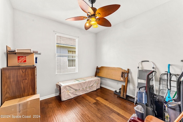 bedroom with ceiling fan and dark hardwood / wood-style floors