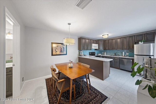 tiled dining room with sink