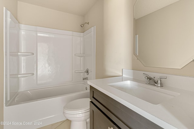 bathroom with toilet, washtub / shower combination, and vanity