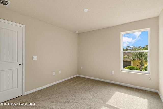 empty room featuring carpet floors