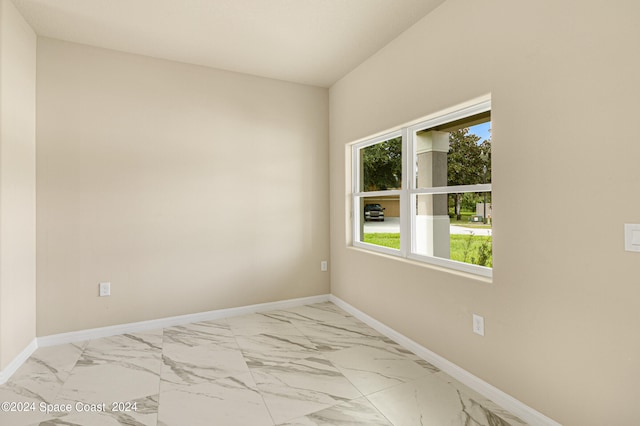 view of tiled spare room