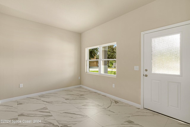 interior space with marble finish floor and baseboards