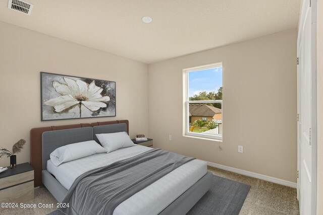 bedroom featuring carpet flooring