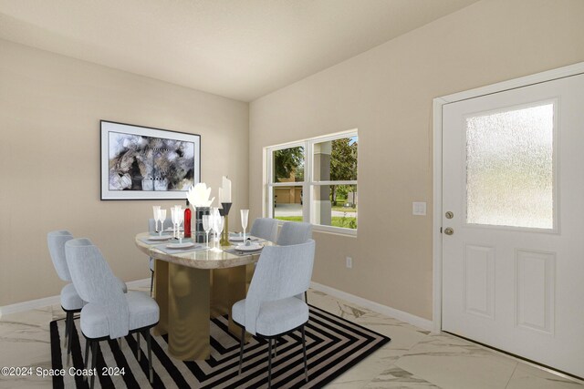 dining area with light tile patterned floors