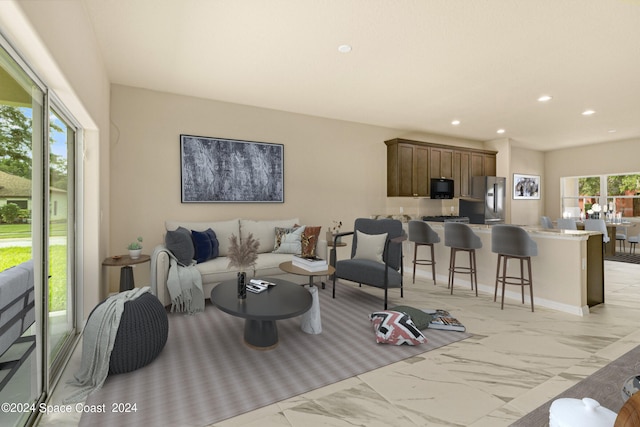 tiled living room featuring a wealth of natural light