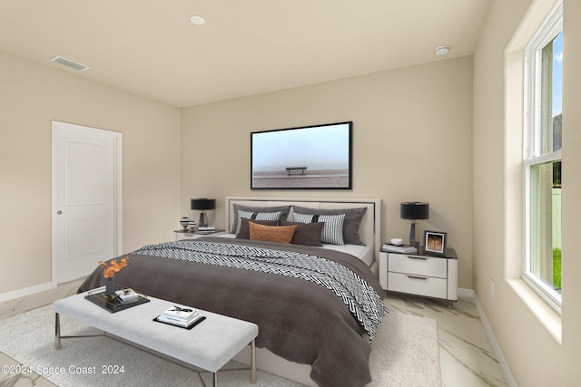 bedroom featuring marble finish floor, visible vents, and baseboards