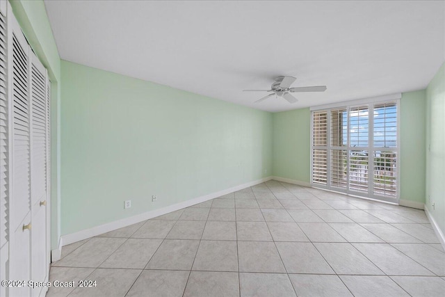 unfurnished bedroom featuring ceiling fan and light tile patterned floors