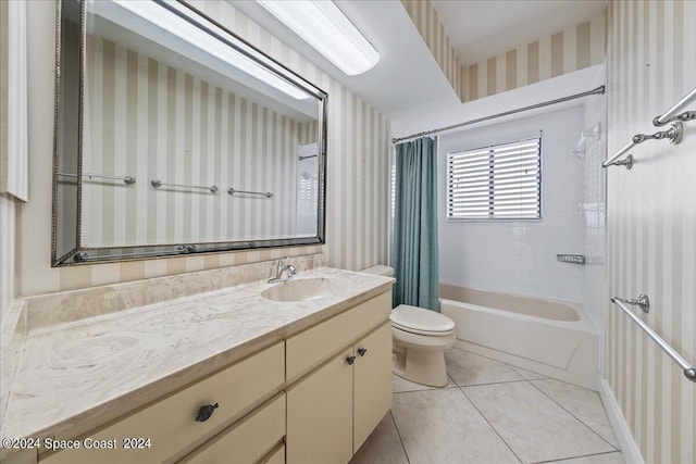 bathroom featuring toilet, shower / tub combo, vanity, tile patterned flooring, and wallpapered walls