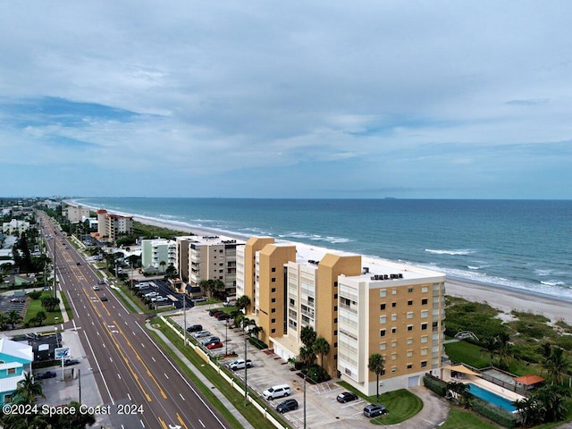 aerial view featuring a view of the beach and a water view