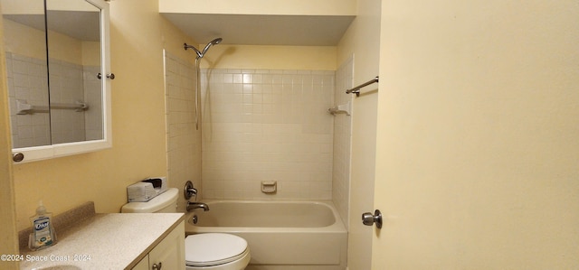 full bathroom with tiled shower / bath combo, vanity, and toilet