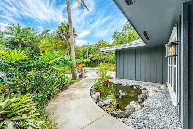 view of yard with a garden pond