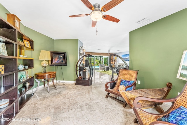 sitting room with ceiling fan