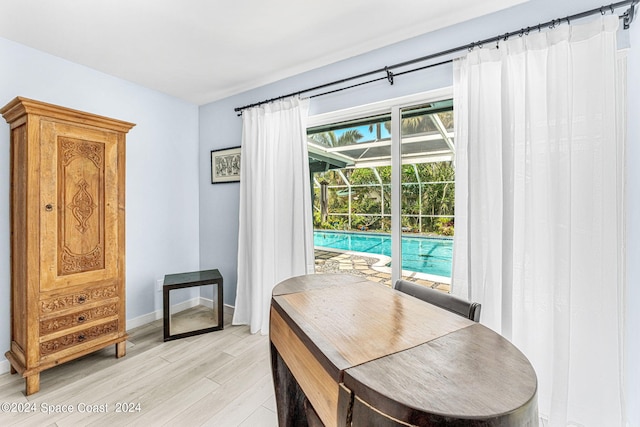 dining space with light hardwood / wood-style flooring