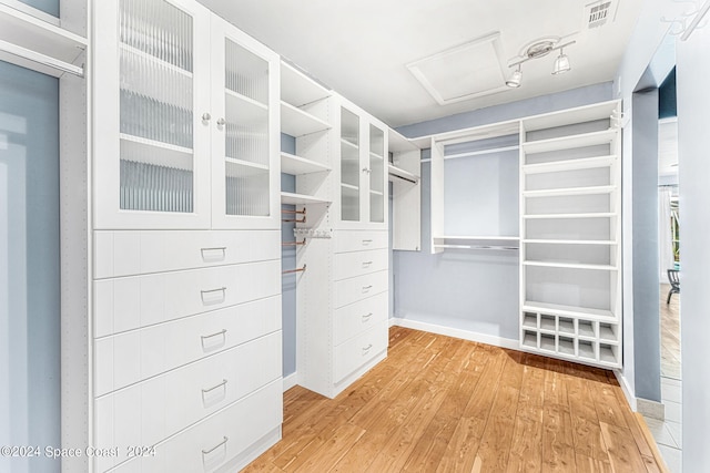 walk in closet featuring light wood-type flooring