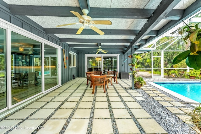 exterior space featuring a lanai, ceiling fan, and a patio area