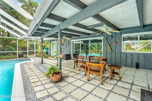 sunroom with a swimming pool