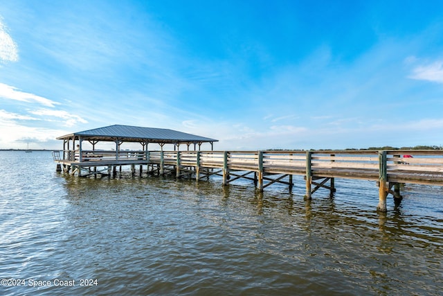 dock area with a water view and a gazebo