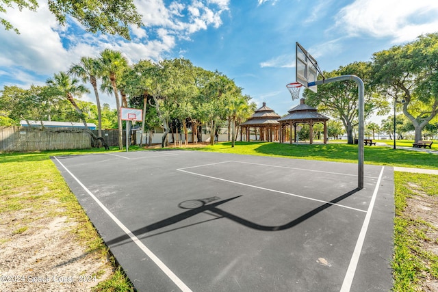 view of basketball court with a lawn and a gazebo