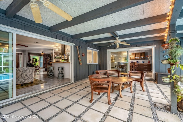 sunroom / solarium with ceiling fan