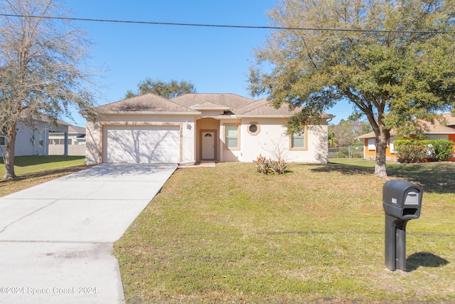 ranch-style house featuring a garage and a front lawn