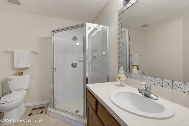 bathroom featuring a textured ceiling, tile patterned flooring, a shower stall, and toilet