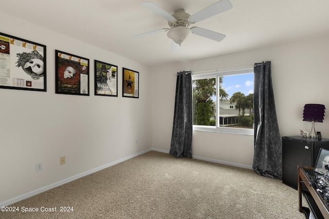 unfurnished room featuring baseboards, a ceiling fan, and light colored carpet