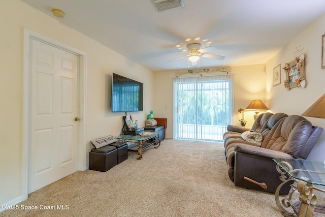 living area with ceiling fan, carpet flooring, and visible vents