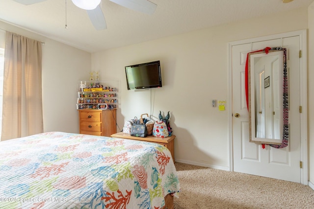 bedroom featuring ceiling fan, baseboards, and carpet flooring