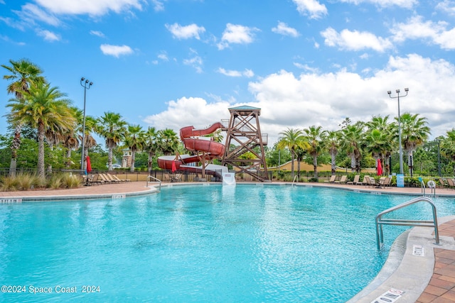 view of pool with a water slide