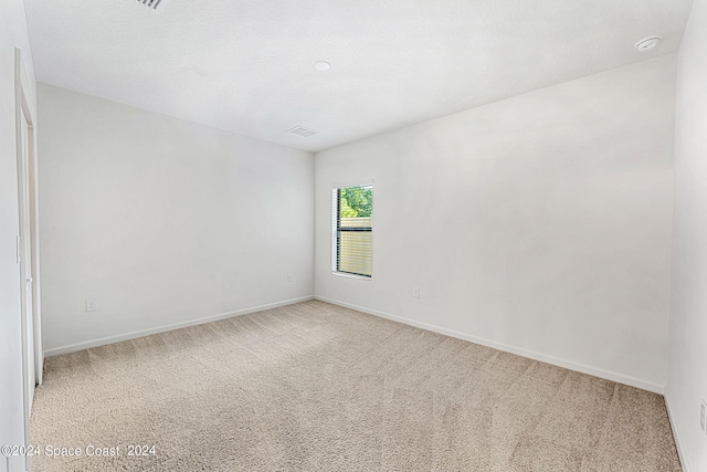 unfurnished room with carpet