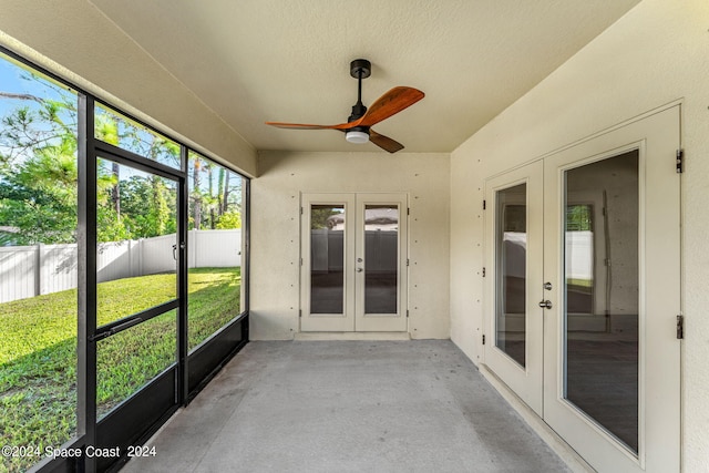 unfurnished sunroom with french doors and ceiling fan