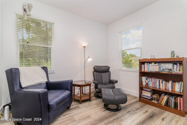 living area with light hardwood / wood-style flooring